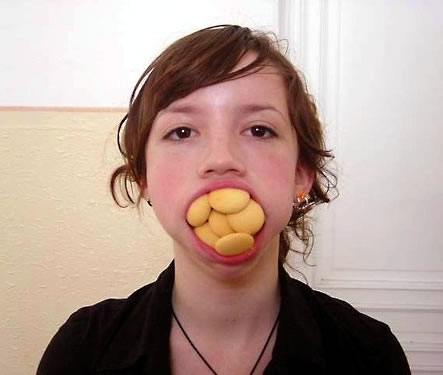 http://www.precisionnutrition.com/wordpress/wp-content/uploads/2009/07/cookie-mouthful.jpg